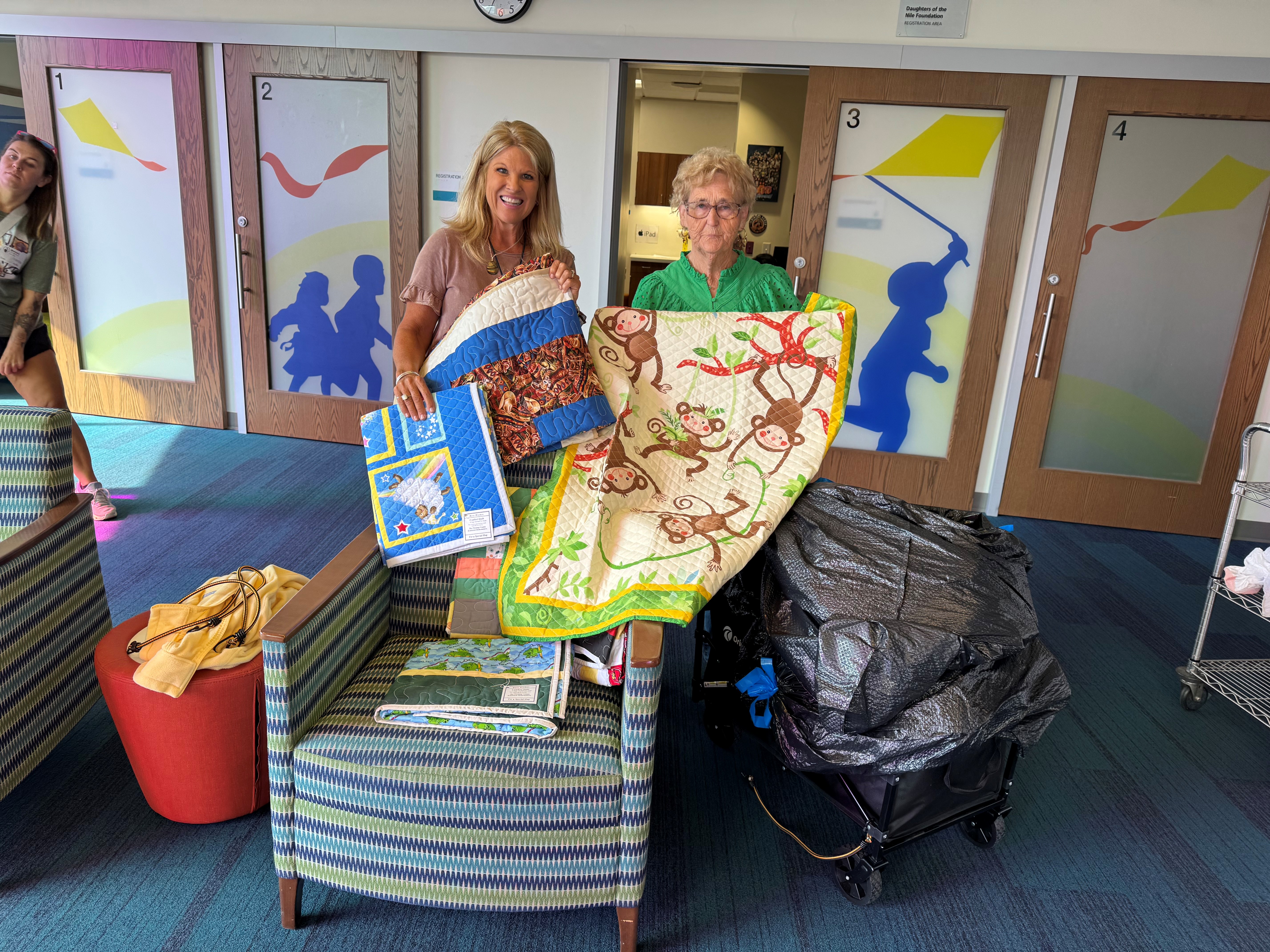 Baby Quilt donation at Shriners Hospital, Violet and Nurse Beth