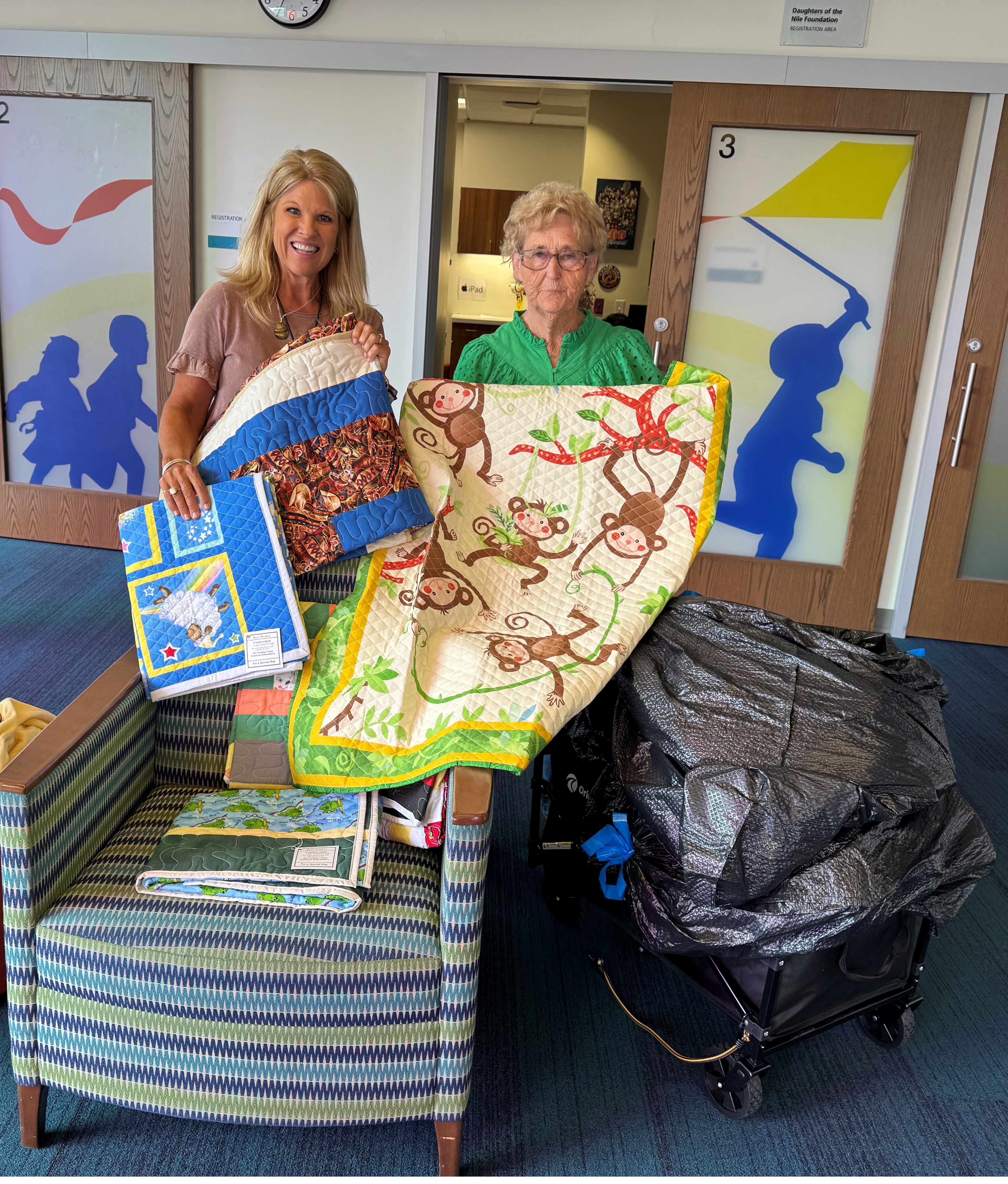 Shriners Hospital - Lexington - 51 baby quilt donation - June 2025 Violet Barbee and Nurse Beth